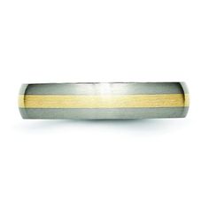 two tone gold and silver wedding band with an edge that matches the rest of the band