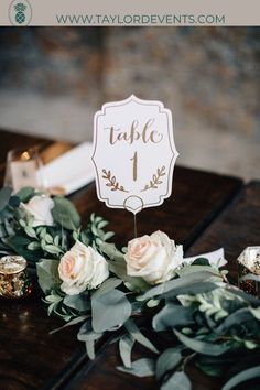 a table with flowers and candles on it