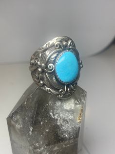 "Turquoise ring Navajo southwest sterling silver women men Size 11.75 Weight 12.2g Length 1 3/16\" Width 3/4\" Thinnest part of band in back 7/32\" Free Shipping & Free Postal Insurance Delivered in a Gift Box Free First Class shipping and postal insurance is included. If you want to upgrade to priority kindly pay an additional fee to do so. This is recommended if you would like to have your package delivered faster than first class which has slowed down" Adjustable Engraved Turquoise Ring, Western Style Stamped 925 Turquoise Ring, Western Style Blue Sterling Silver Ring, Western Style Untreated Sterling Silver Rings, Collectible Southwestern Turquoise Ring Stamped 925, Collectible Western Style Turquoise Ring Stamped 925, First Class, Rings Statement, Sterling Silber