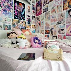 a bed with lots of pictures on the wall