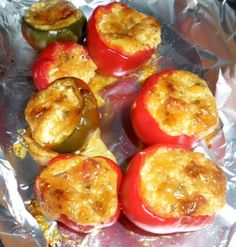 several stuffed peppers sitting on top of aluminum foil