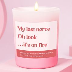 a pink candle with the words, my last nerve oh look it's on fire