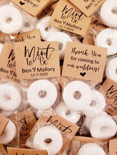 wedding favors with thank you to the bride and groom written on them in brown paper