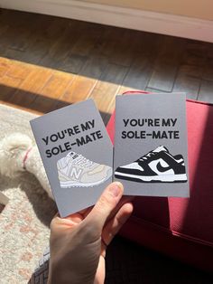 someone is holding up two cards that say you're my sole - mate