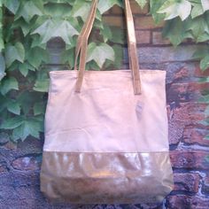 Made Of Heavy Canvas And High-Quality Beige With Gold-Tone Faux Leather Accents Features 13" Shoulder Straps Overall Dimensions: 16.25"H X 14.25"W X 4"D Gold Canvas, Leather Accents, Martha Stewart, Womens Tote Bags, Leather Tote, Shoulder Straps, Gold Tones, Faux Leather, Canvas