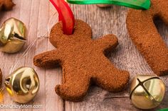 gingerbread man ornament with bells on wooden table