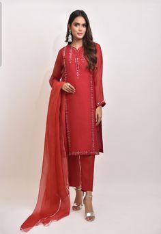 A blend of pure cotton net with intricate hand sheesha work. Paired with pure organza dupatta and raw silk trousers Delivery Time: 4 to 8 weeks Trouser Suit, Silk Trousers, Modest Wear, Organza Dupatta, Net Dupatta, Wearing Red, Trouser Suits, Top Fabric, Wedding Wear