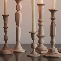 several candles are lined up on a table