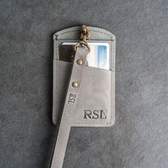 This is the best ID Card Holder and Lanyard that you’ll ever own. The window will show off your ID beautifully and with an extra pocket in the back for a couple of cards, you can carry your essentials securely. Treat yourself to the high quality leather good you deserve.SPECS • Size: Width 2.75” and Height 4.5”• Lanyard Length Options (without ID Card Holder): Short (about 18") and Long (about 24") • Leather Color Options: Choose from Rustic Brown, Dark Brown, Saddle Tan, Rustic Gray, or Black • Rectangular Rfid Blocking Badge Holders For Everyday Use, Rectangular Badge Holder With Card Slots For Everyday Use, Rectangular Badge Holder With Card Slots, Everyday Rectangular Card Holder With Id Window, Leather Badge Holder, Roman Fonts, Black Lanyard, Times New Roman, Rustic Brown