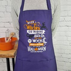 a person wearing an apron with the words witches on it