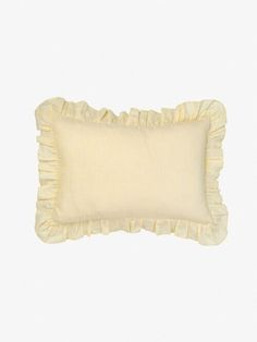 a white pillow with ruffles on it