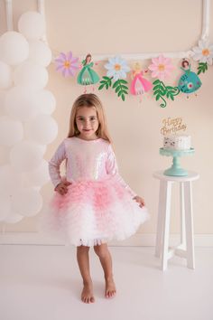 Little girls will love this ballerina dress with sequined fabric on the inside, lycra lining on the inside and a self-contained body. There is a zipper at the back. It is pink and white in color. Pink Long Sleeve Princess Birthday Dress, Pink Long Sleeve Princess Dress For Birthday, Princess Dress With Ruffles For Birthday Party, Long Sleeve Princess Fairy Dress For Party, Fitted Fairy Dress For Party, Pink Princess Long Sleeve Tutu Dress, Cute Pink Sequin Dress, Pink Long Sleeve Princess Tutu Dress, Long Sleeve Tulle Princess Dress For Birthday