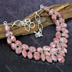 Dive into the magical temptation of this stunning Necklace in attractive shape and design made of Silver Plated studded with Rhodochrosite. An essential ornament to add in your jewellery collection! ----------------------------------- Welcome TO Our Shop Mohan Jewels ----------------------------------- Natural Rhodochrosite Gemstone Necklace, Rhodochrosite Choker Adjustable Silver Plated Necklace Jewelry, Anniversary Gift, Necklace For Her SKU : EQN-311 Gemstone : Rhodochrosite Stone Shape : Pear Metal : Silver Plated Base Metal :- Brass Style : Choker Length : 18 Inches * Jewelry Care Tips:- ----------------------- 1)Avoid Exposure to Moisture:- Remove jewelry before showering, swimming, or doing household chores. Store jewelry in a dry place to prevent tarnishing and corrosion. 2)Minimiz Rhodochrosite Necklace, Pink Stone Necklace, Pink Choker, Store Jewelry, Necklace For Her, Household Chores, Silver Plated Necklace, Silver Plated Jewelry, Stunning Necklace