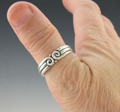 Silver Double Scroll Ring/ Sterling Silver Swirl Band/ Silver Wedding Band/ Men's Wedding Band/ Unisex Wedding Band/ Silver Thumb Ring R1166- Sterling Silver Double Scroll Band. This ring can be used as a Men's or Women's Wedding Band or would make a great Thumb or Middle Finger Ring also. Nice sturdy design with Scrolls that give it a Victorian or Egyptian flair to the design. It is a One of a Kind Ring made by me from start to finish. Simple Unisex design. It is a size 10 1/2. I can size it to Hand Forged Spiral Jewelry For Anniversary, Unique Swirl Rings For Anniversary, Scroll Ring, Wedding Band Silver, Middle Finger Ring, Swiss Blue Topaz Ring, Thumb Rings Silver, Silver Wedding Band, Artisan Rings