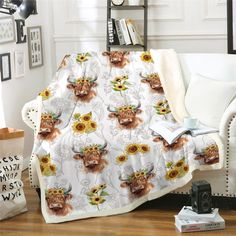 a living room with a couch covered in sunflowers and an animal print blanket