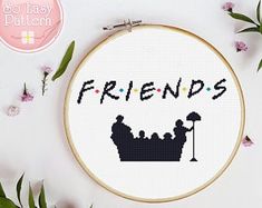 a cross stitch pattern with the words friends in black and white, surrounded by flowers