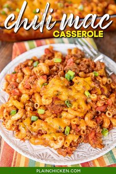 a plate full of chili mac and cheese casserole on a colorful table cloth