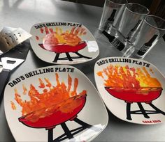 three plates with the words god's grilling plate painted on them next to utensils