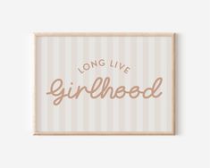 a framed sign that says, long live girlhood