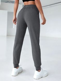 Activity:Running & Work Out \nWaist Line:High Waist \nDetails:Knot \nDetails:Pocket \nFit Type:Regular Fit \nType:Tapered/Carrot \nColor:Dark Grey \nPattern Type:Plain \nLength:Long \nFabric:High Stretch \nMaterial:Fabric \nComposition:90% Polyester \nComposition:10% Elastane \nCare Instructions:Machine wash or professional dry clean \nSheer:No \n Tapered Sweatpants, Sports Sweatpants, Sports Pants Women, Basic Yoga, Home Sport, Outdoor Woman, Womens Sweatpants, Sport Pants, Active Wear For Women