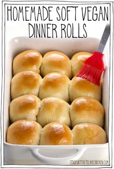 homemade soft vegan dinner rolls in a white baking dish with a red spatula