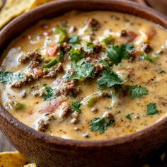 a bowl of soup with tortilla chips on the side