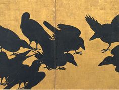 birds are silhouetted against a wall with yellow and black paint