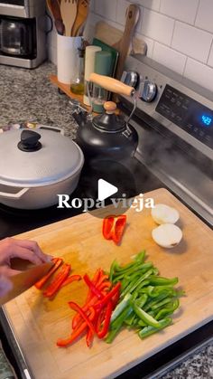 a person chopping peppers on a cutting board