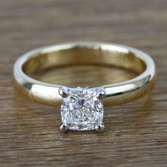 a close up of a ring with a diamond on the top and bottom part of it