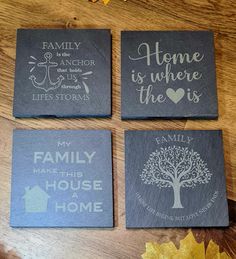 three slate coasters with family quotes on them sitting on a table next to autumn leaves