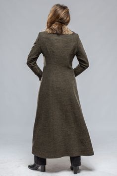 Over the last few years we have featured this coat in various fabrics and all have been fabulous. This year we chose to make it in a beautiful wool blend with nutria fur trim because we love the timeless elegance of this combination. 60% wool, 40% viscose Fully lined, fur trimmed Closure: Two hook-and-eye clasps 2 pockets flatteringly positioned near the front of the coat Fit: Runs just a touch small so we recommend sizing up if in between sizes. Model is wearing a size 38 (Height 5'8", Shoulder Luxury Long Tweed Coat With Pockets, Luxury Tweed Long Sleeve Outerwear, Timeless Long-sleeved Tweed Outerwear, Elegant Single-breasted Tweed Wool Coat, Retro Long-sleeved Tweed Outerwear, Fur Trim Coat, Travel Jacket, Mac Jeans, Knit Outerwear