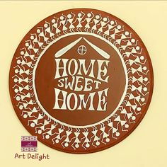 a brown and white sign with the words home sweet home in it's center