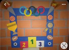 a bathroom decorated in the shape of a photo frame with numbers and sports related objects