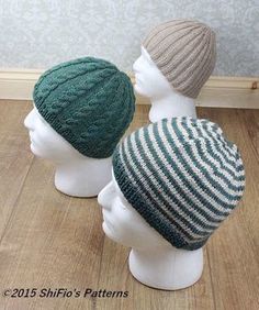 three knitted hats sitting on top of white mannequin heads in front of a wall