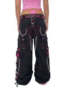 Accept no imitations! From the originator of all things DarkStreet, these black and pink studded pants zip off into shorts (★≧▽^))★☆. They feature two skulls on each leg, removable chains, adjustable ankles, D-rings, and deep pockets. – Drawstring and adjustable waist buckles allow for a tighter fit on the waist. 100% Cotton. Waist measurements are based on the waistband's full extension - that is the maximum inches that the waist will extend to. MODEL IS WEARING X-SMALL SIZE WAIST (Fully Extend Pink And Black Pants, Skull Outfits, Alt Style Outfit, Studded Pants, Skull Pants, Tripp Pants, Punk Clothing, Alt Style, Skull Clothing