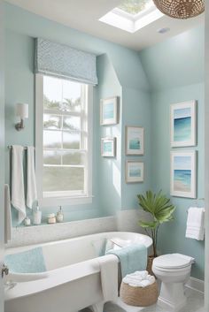 a bathroom with blue walls, white fixtures and a bathtub in the middle of the room