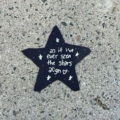 a black star with writing on it that says as if i've ever seen the stars align vy