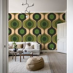 a living room with green and yellow wallpaper