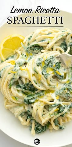 lemon ricotta spaghetti with spinach and white sauce in a bowl on a table