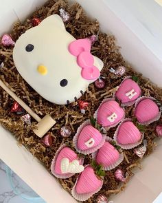 a hello kitty cake in a box with chocolates