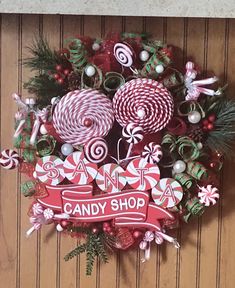 a christmas wreath with candy canes and candies