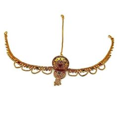 a gold necklace with an intricate design on it