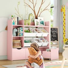 This is definitely what you want for your kids room! This bookcase is compact and offers multiple storage options for children. There are 3 compartments on the left side, suitable for storing and displaying books and toys, and 6 storage boxes on the right side, providing classified storage space. The sliding storage drawer at the bottom makes storage more convenient, fun and easy! Latitude Run® Color: Pink | Latitude Run® Bookcase w / toys Organizer, 3 Removable Drawers 42.1 H x 47.2 W x 11.8 D Toys Organizer, Displaying Books, Youth Furniture, Playroom Storage, Toddler Furniture, Toys Dolls, Plush Toy Dolls, Toy Organization, Crib Sheets