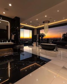 an elegant bathroom with black and white marble flooring, large window overlooking the sunset