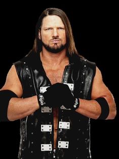 a man with long hair wearing a black leather vest and holding his hands in one hand