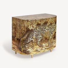 an ornately decorated wooden cabinet with gold paint