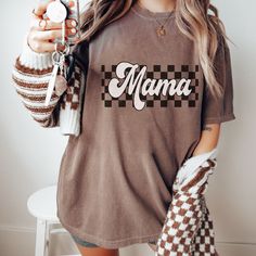 Checkered Mama Shirt, Retro Mama Crewneck, Motherhood Comfort Colors Shirt, Mothers Day Gift From Daughter, First Mothers Day, Mom Gift Idea ◆ We ship  in 3-5 business days ◆ If you need an item in a RUSH please message us prior to ordering and we will work on accommodating you Comfort Colors Shirt Details  ◆ Unisex Style T-Shirt ◆ Comfort Colors Brand ◆ 100% Cotton ◆ Light/medium weight and extremely soft, this shirt will surely be your next favorite t-shirt. ◆ Garment is pre-shrunk during the Retro Cotton Tops For Mother's Day, Mama Crewneck, Mothers Day Gifts From Daughter, Mama Shirts, First Mothers Day, Comfort Colors Shirt, Mama Shirt, Graphic Tees Women, Unisex Style