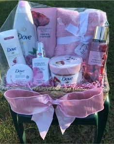 a basket filled with personal care products on top of a green chair in the grass