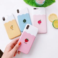 three phone cases with fruit on them sitting next to some lemons and lime slices