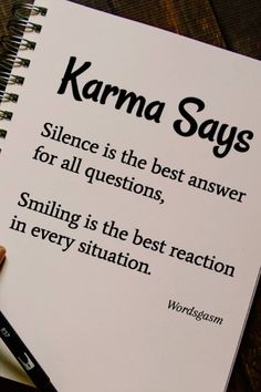 a notebook with the words karma says on it